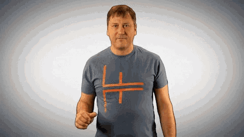 a man wearing a t-shirt with a cross drawn on it