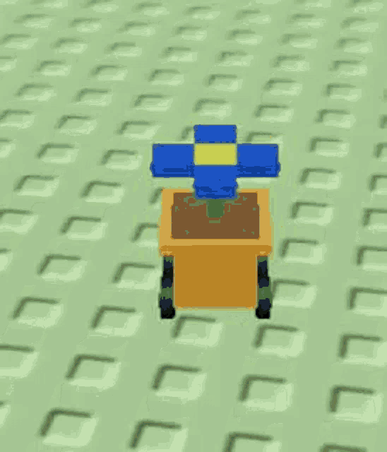 a blue and yellow flower in a yellow pot with wheels