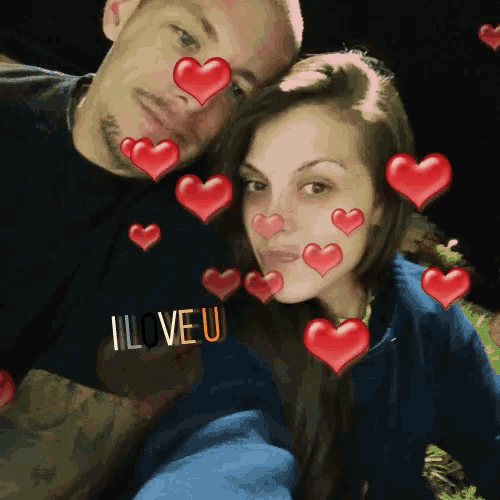a man and a woman are posing for a picture and the man is wearing a shirt that says i love you