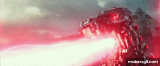 a robot with red eyes is shooting a red laser .
