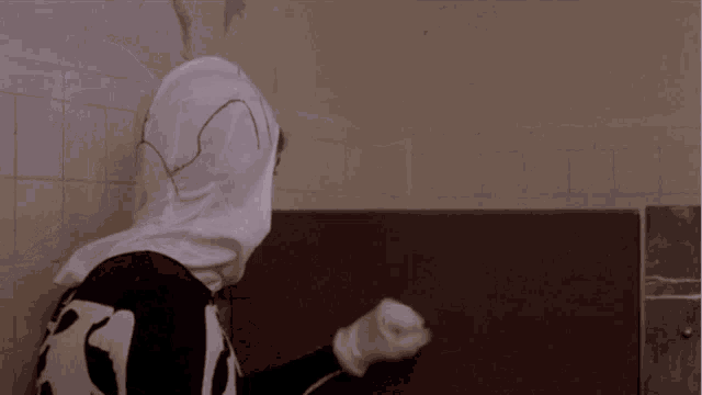 a man in a skeleton costume has headphones on