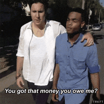 two men are walking down the street and one of them says " you got that money you owe me ? "