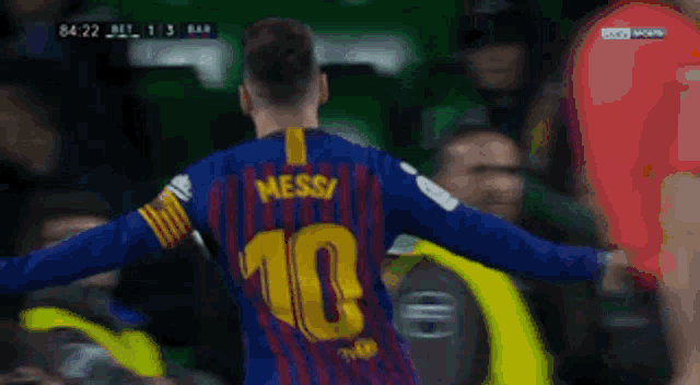 a soccer player wearing a jersey with messi on it
