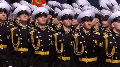 a group of men in military uniforms are lined up