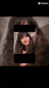 a blurry picture of a person with the word capcut in the corner