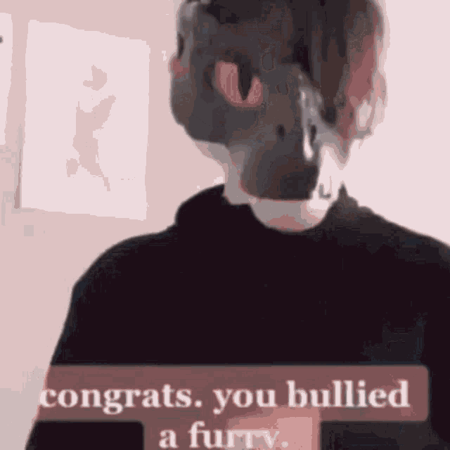 a person wearing a mask with a red eye and the words congrats you bullied a furry