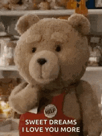 a teddy bear is holding a red box and saying `` sweet dreams , i love you more '' .