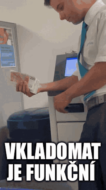 a man holding a stack of money with the words vkladomat je funkcni written below him