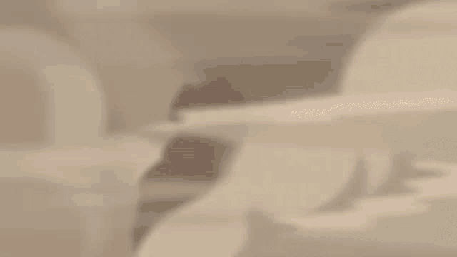a blurred image of a person 's face with a red and purple background .