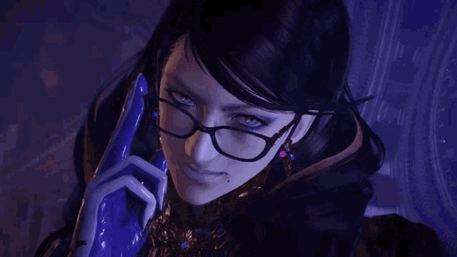 a woman wearing glasses and a blue glove looks at the camera
