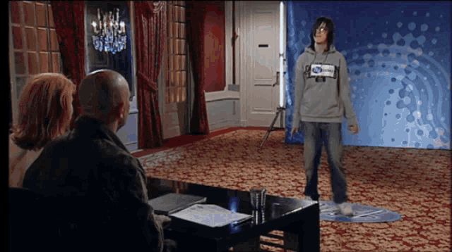 a person wearing a sweatshirt that says ' ford ' on the front