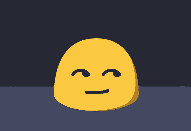 a yellow smiley face with a brick wall behind it