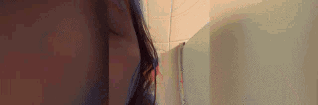 a close up of a person 's face with a blurred background