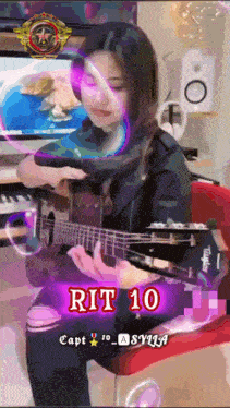a girl playing a guitar with the number 10 on the bottom right