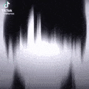 a close up of a person 's face with a shadow of a person 's hair .
