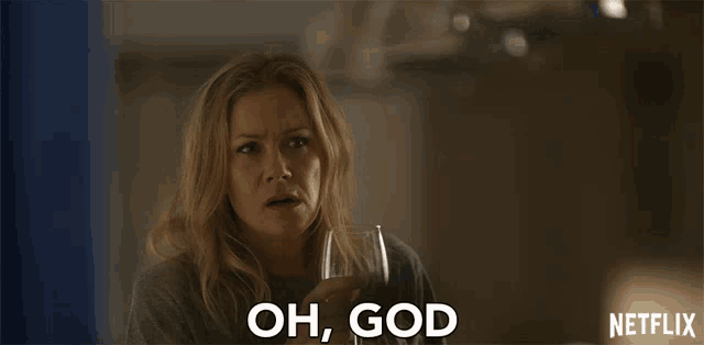a woman holding a glass with the words oh god on her face