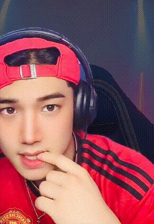 a man wearing headphones and a red hat with the word united on it