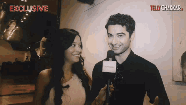 a man and a woman are being interviewed by a tv channel called tellychakkar