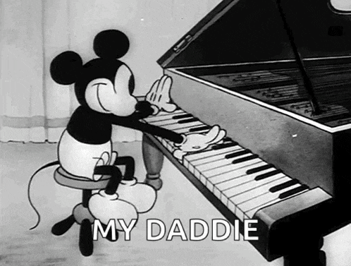 a black and white cartoon of mickey mouse playing the piano