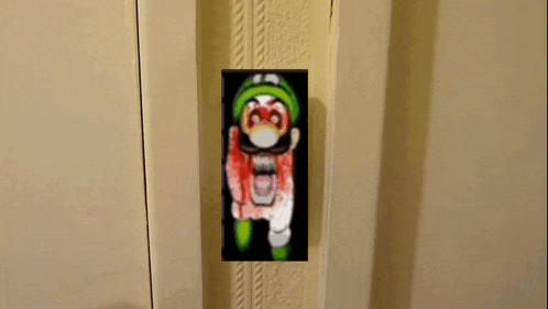 a picture of a cartoon character with blood on his face is on a wall