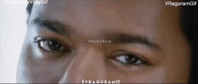 a close up of a man 's eyes with the words vraguram written on the bottom right