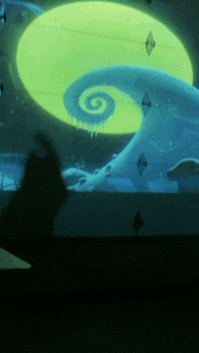 a nightmare before christmas swirl is projected onto a wall