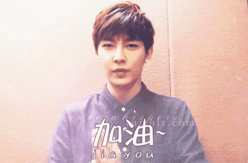 a man with chinese writing on his shirt says jia you