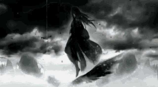 a silhouette of a woman standing on top of a cliff in the clouds .