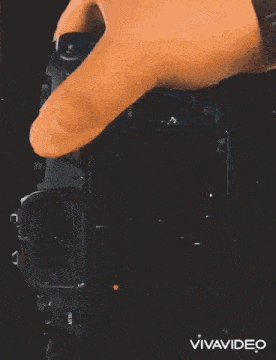 a person is taking a picture of another person with a camera .