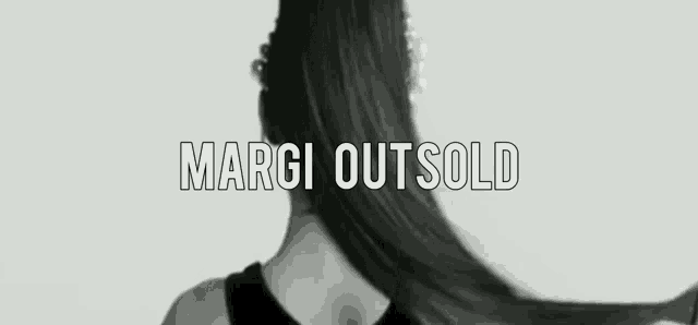 a black and white photo of a woman with the words " margi outsold " above her head