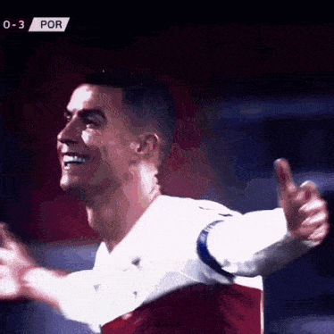 a soccer player is smiling and giving a thumbs up .