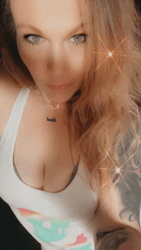 a woman wearing a white tank top has a tattoo on her arm that says " i love you "