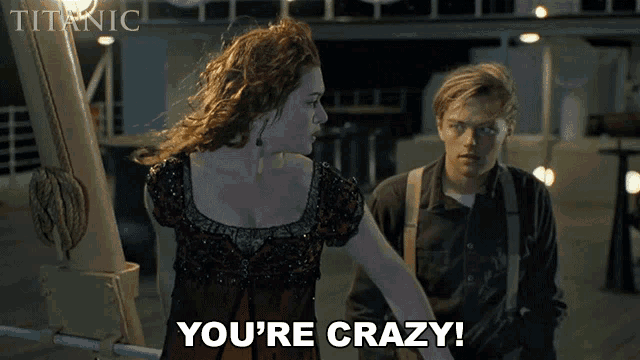 a man and a woman standing next to each other and the woman says " you 're crazy "