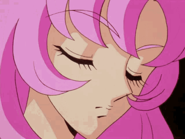 a close up of a woman 's face with her eyes closed