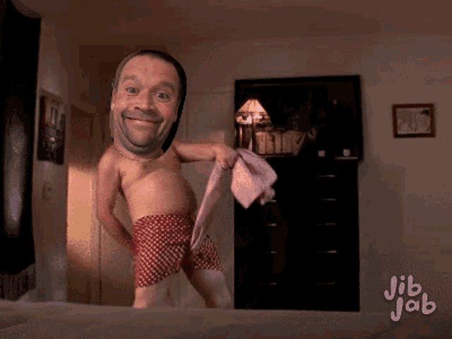 a man without a shirt is dancing on a bed with jib jab written on the bottom right