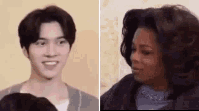 a man and a woman are standing next to each other and the woman is smiling .