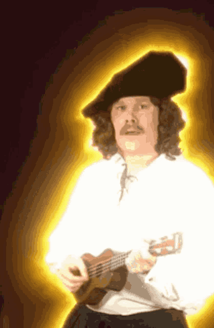a man with curly hair and a mustache is playing a guitar