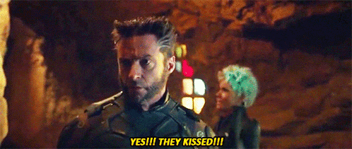 a man with a beard is standing next to a woman with green hair and says `` yes ! they kissed ! ''