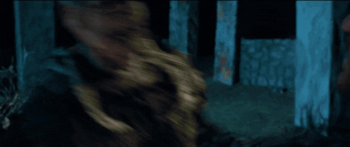 a blurry picture of a person walking in the dark