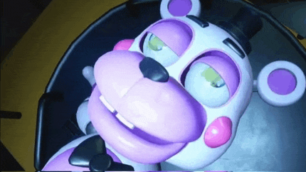 a pink and white teddy bear with purple eyes is sitting on a chair .