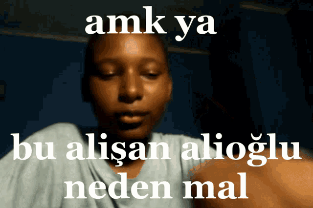 a man 's face is behind a sign that says amk ya
