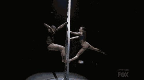 a man and a woman are dancing on a pole and the fox logo is visible