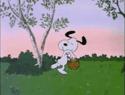 a cartoon of snoopy carrying a basket in the grass