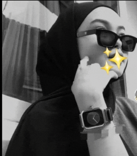 a black and white photo of a woman wearing sunglasses and an apple watch