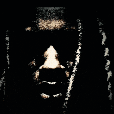 a drawing of a man 's face with red eyes
