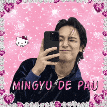 a young man taking a selfie with the name mingyu de pau on the bottom