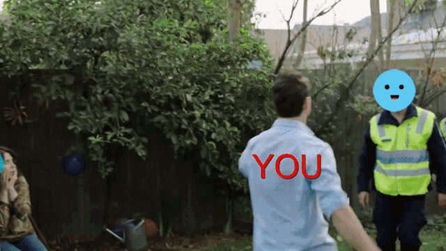 a man in a blue shirt with the word you on the back