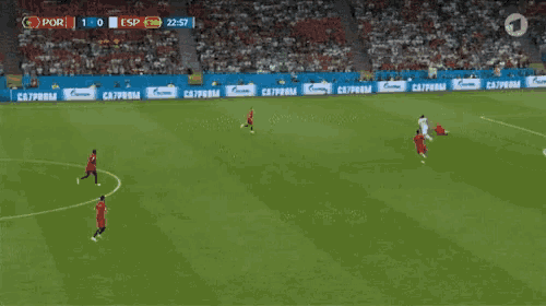 a soccer game is being played in a stadium with ads for gazprom