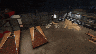 a room with a few tables and a few pieces of wood