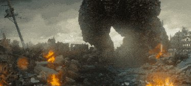 a large monster is standing in the middle of a destroyed city ..